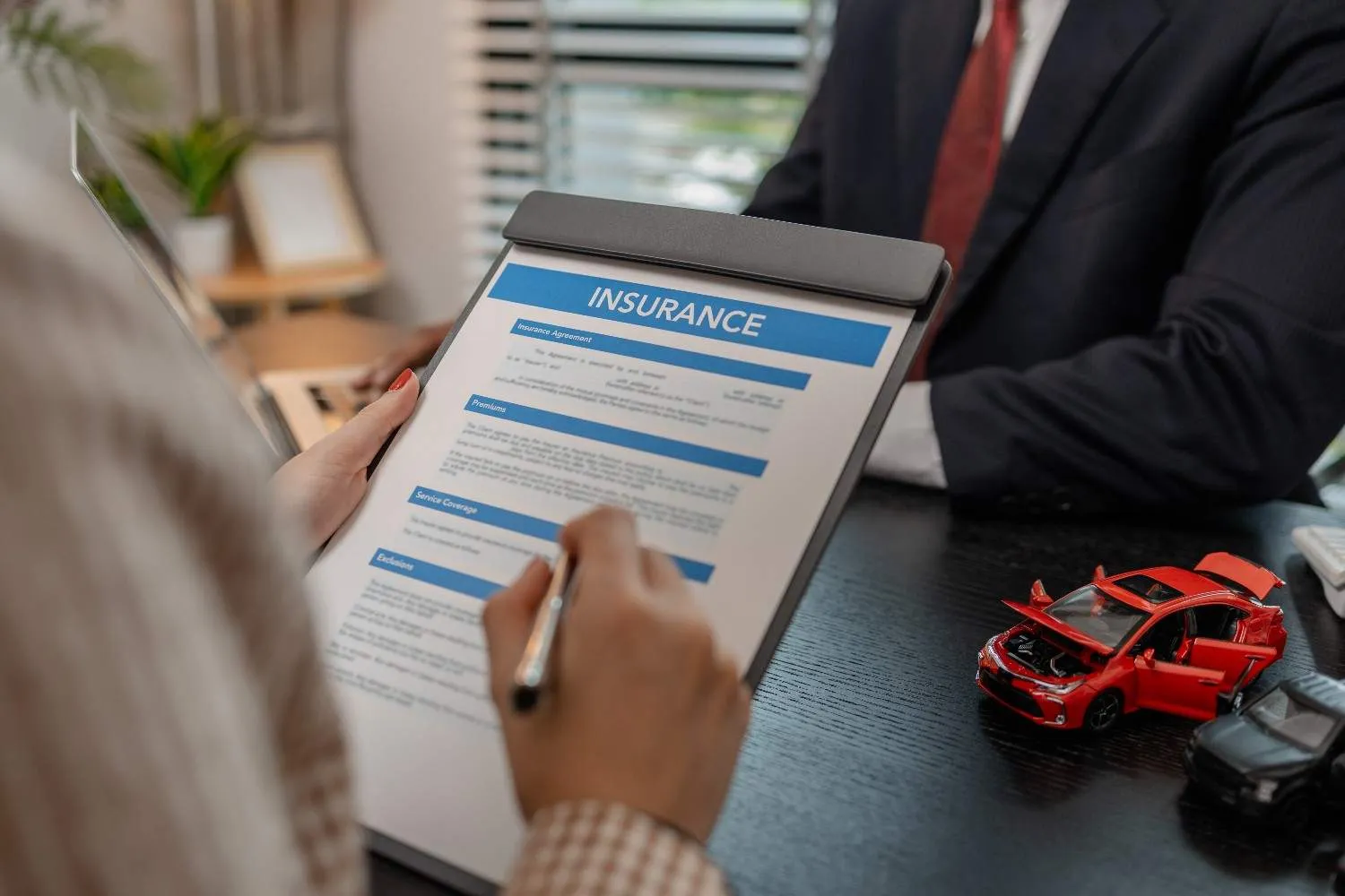 Reviewing policy paperwork at a desk